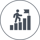 Person climbing bar chart with flag.