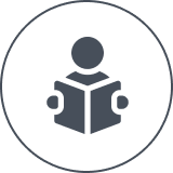 Person reading icon on black background.