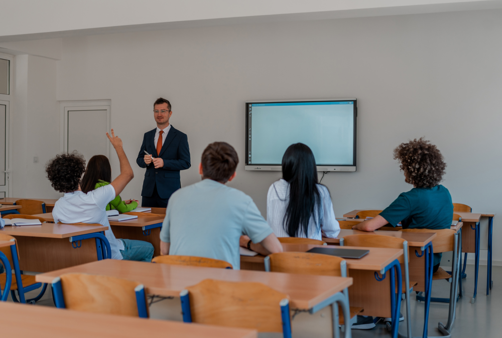 Teacher and students in a classroom discussion.